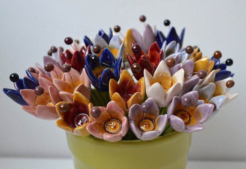 Colourfull, hand-made, lovely ceramic flowers: tulip, avaiable in 7 colours. 
They are fixed on a green wire (l=20cm), you can put them in a vase, next to your inside plant or outside.