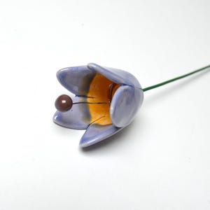 Colourfull, hand-made, lovely ceramic flowers: tulip, light blue.
They are fixed on a green wire (l=20cm), you can put them in a vase, next to your inside plant or outside.
