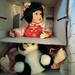Mei Mei porcelain doll with panda bear