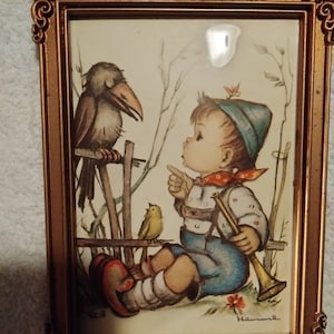 Hummel Boy sitting with Crow in plastic frame
