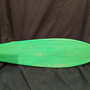 Vintage 1970s Green Scamp Skateboard with Yellow Wheels