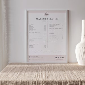 May include: A white framed price list for makeup services. The list includes bridal makeup, makeup lessons, photoshoot makeup, prom makeup, festival makeup, special fx makeup, and other services. The price list also includes contact information for the business.