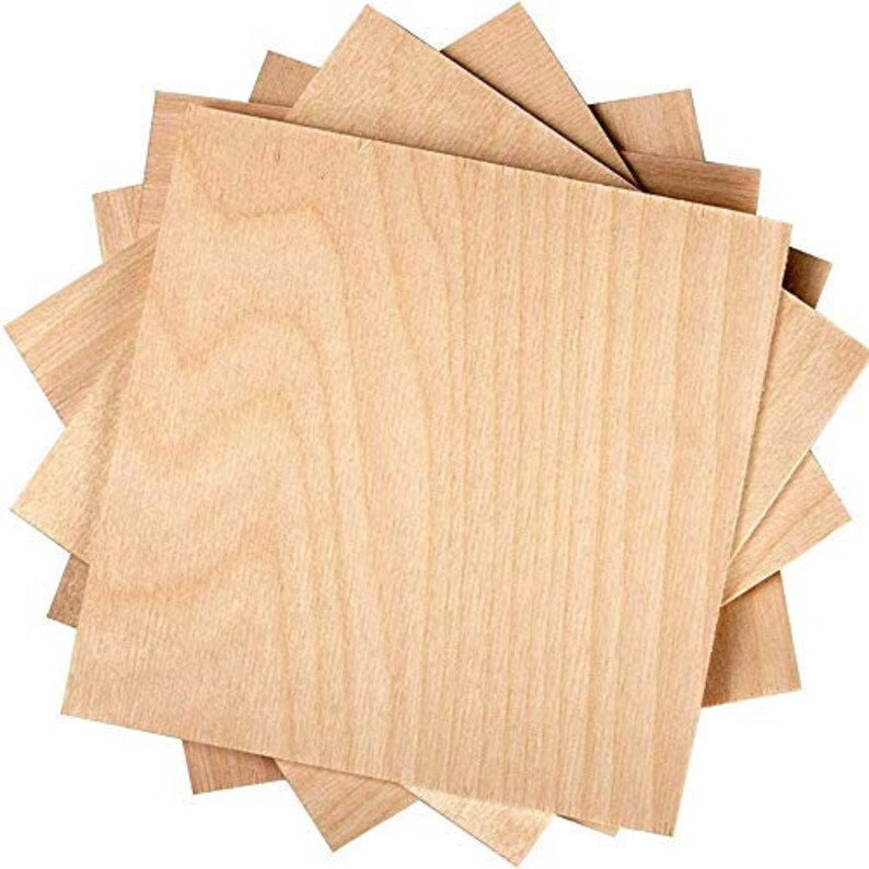 May include: A stack of four unfinished wood squares, each with a natural wood grain pattern. The wood is light brown in color and has a smooth surface.