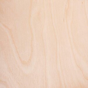May include: A close-up of a light brown wood surface with a natural grain pattern.