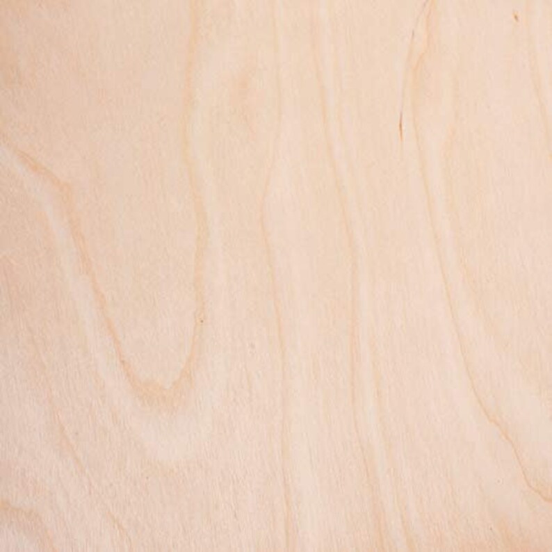 May include: A close-up of a light brown wood surface with a natural grain pattern.