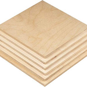 May include: A stack of five unfinished wood squares, each measuring 12 inches by 12 inches. The wood is a light brown color and has a smooth surface.