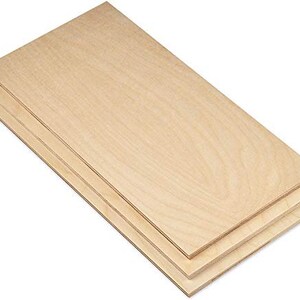 May include: Three sheets of unfinished, natural wood plywood. The plywood is light brown and has a smooth surface.
