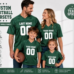 May include: Dark green V-neck football jerseys with white lettering and numbers. The jerseys feature customizable text fields for team name, last name, and number. The design includes breathable mesh fabric, short sleeves, and a standard athletic fit.