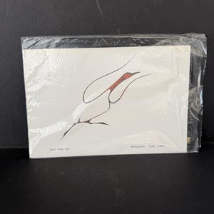 May include: A white card with a minimalist abstract design in black and red, encased in clear plastic. The text "Wait for me!" and the artist's name are visible.