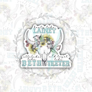 May include: A sticker with a white skull with a floral crown of sunflowers and roses. The text reads "booty like LAINEY attitude like BETH TEETER and loyal like BETH TEETER".