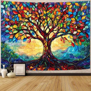 May include: A vibrant tapestry featuring a stained-glass style tree with colorful leaves in shades of red, orange, yellow, and blue. The tree's trunk and roots are a deep red-brown, set against a backdrop of a sunset and mountains.