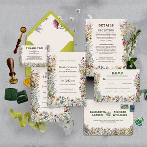 May include: A wedding invitation suite featuring cream-colored paper with colorful wildflower illustrations. Includes a green envelope, a wax seal stamp, a dark green ring box, and printed cards for details, RSVP, and thank you notes with floral borders.