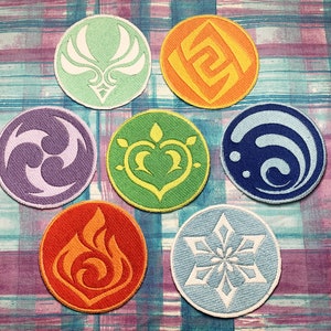 May include: Seven embroidered patches in different colors and designs, each representing a different element: Anemo (green), Geo (yellow), Electro (purple), Hydro (blue), Pyro (orange), Cryo (light blue), and Dendro (light green).