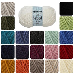 May include: A collection of yarn skeins in various colours, including white, black, green, blue, red, orange, and brown. The yarn is labelled "Wendy with Wool Aran 400g".