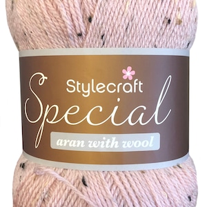 May include: A ball of pink yarn with flecks of brown and black. The yarn is labelled "Stylecraft Special aran with wool."