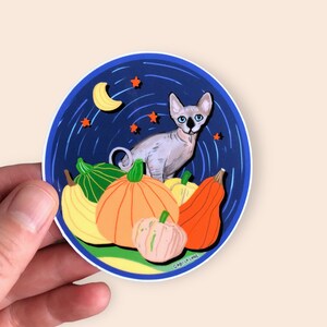 Vinyl sticker: Sphynx cat and squashes. Autocollant en vinyle.