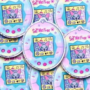 Sphynx Tamagotshi calling for freedom Vinyl and HOLOGRAPHIC sticker. Autocollant d’un tamagotshi de sphynx. Great quality sticker.