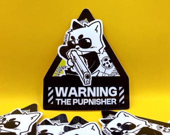 May include: A black and white sticker featuring a cartoon dog wearing sunglasses and holding a gun, set within a black triangle. The text "WARNING THE PUPNISHER" is displayed below the dog. Additional stickers are scattered around.
