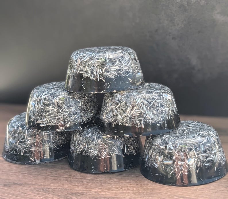May include: A set of three ceramic mugs with a speckled, matte finish in cream, light grey, and dark grey. Each mug has a simple, modern design and a rounded handle.