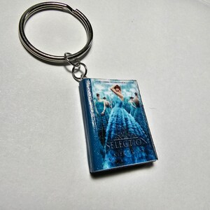 De Selection mini-boeksleutelhanger of -magneet