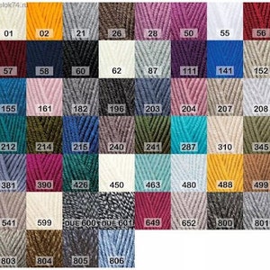 May include: A chart of yarn colors with numbers corresponding to each color. The yarn colors include shades of blue, green, red, pink, brown, gray, white, and yellow.