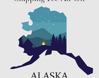 May include: A silhouette of the state of Alaska with a starry night sky and a campfire scene inside. The text "Shipping Fee Ad-On" is at the top and "ALASKA" is at the bottom.