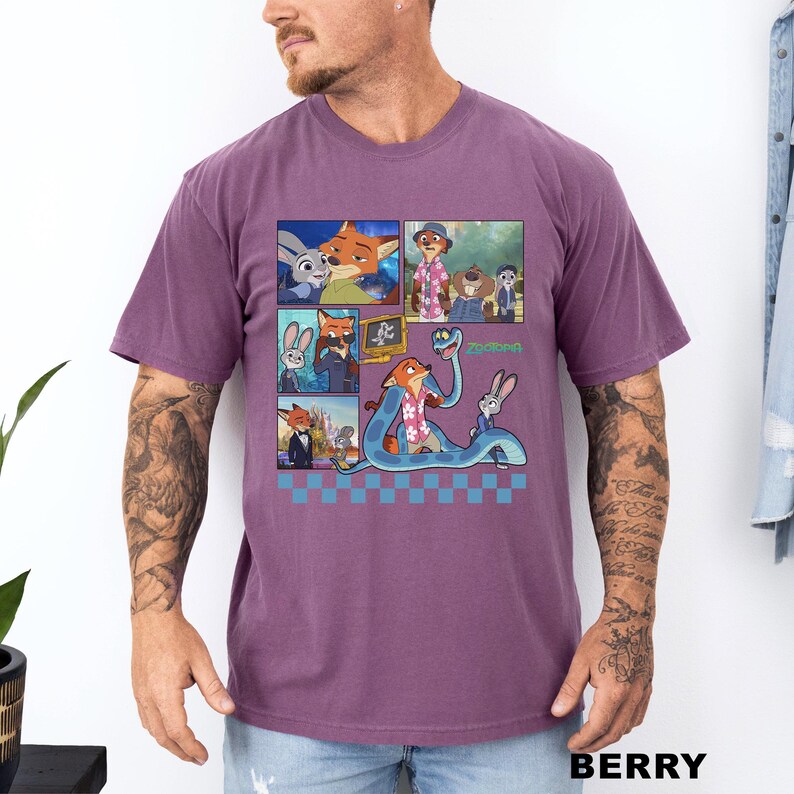 以下が含まれることがあります： ベリー色のTシャツ。アニメ映画「ズートピア」のキャラクターのカラフルなグラフィックが特徴です。グラフィックには、キツネ、ウサギ、その他のキャラクターの画像が含まれています。「ズートピア」の文字も表示されています。