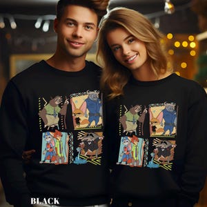 May include: Black sweatshirt featuring a colorful cartoon design with animal characters. The design includes a sloth, fox, bull, and other characters in a square pattern. The word "BLACK" is printed at the bottom of the sweatshirt.