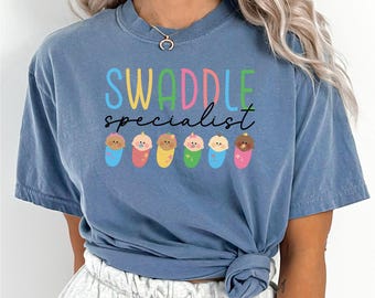 Swaddle Specialist Shirt, Comfort Colors, Labor And Delivery Nurse Shirt, NICU Nurse Shirt, Baby Nurse Shirt, Neonatal ICU Nurse Tee, 163474