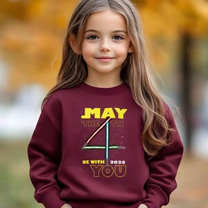 May include: A set of three ceramic mugs with a speckled, matte finish in light blue, cream, and grey. The mugs have a simple, modern design, suitable for coffee or tea.