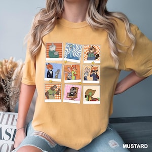 May include: Mustard-colored t-shirt featuring a grid of cartoon character portraits in a retro style. The portraits include various animal characters in different outfits and poses. The word "MUSTARD" is printed at the bottom right.