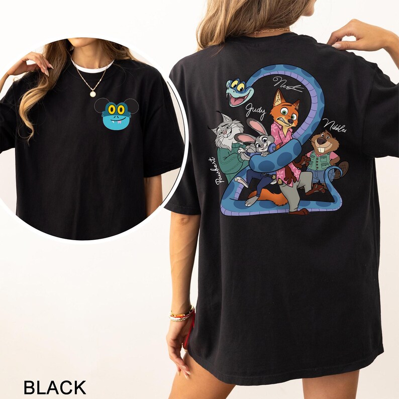 May include: Black t-shirt with a cartoon character on the front and a group of cartoon characters with a snake on the back. The front design is a blue face with yellow eyes. The back design includes the names Judy, Nick, and Nibbles.