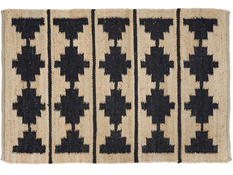 May include: A rectangular jute rug with a geometric pattern in black. The rug has a natural, earthy look and feel.