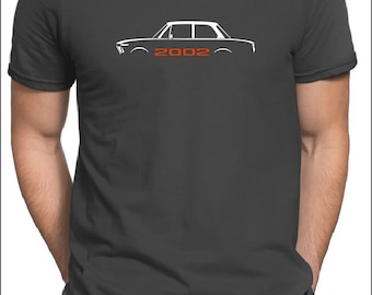 May include: A dark gray t-shirt with a white silhouette of a 2002 BMW 2002. The year 2002 is printed in red below the car.