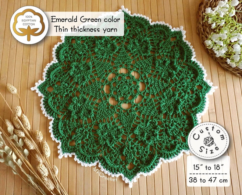 Green doily hand crocheted with thin thickness yarn, custom size 15 to 18 inches in bright emerald green edged with white little waves. Creative shamrocks in relief in a circle around the center of the piece.