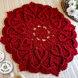 Dark red textured doily with hearts in relief. Customizable in various sizes between 19 and 25 inches in diameter and in deep red or white color. Hand crocheted with a stunning and slightly shiny egyptian cotton.