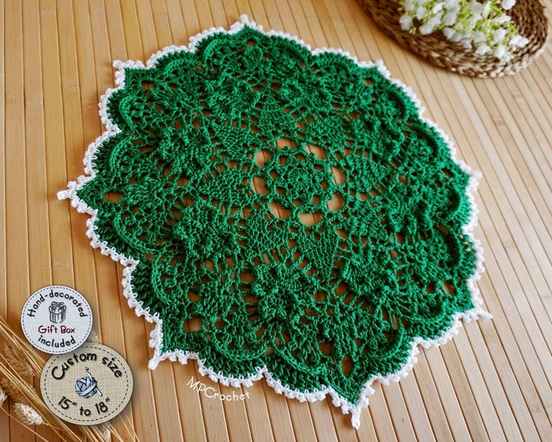 Hand crochet doily in bright emerald green edged with white little waves. Thin thickness yarn creating creative embossed shamrocks in a circle around the center of the piece.