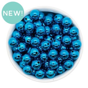 May include: A bowl filled with bright blue metallic round beads. The beads have a shiny finish and two holes.