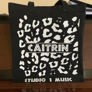 Wild Rhythms: Leopard Print Music Fusion Tote Bag!