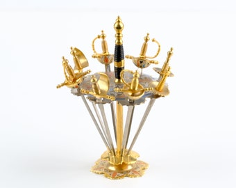 Eight Toledo Cocktail Swords in a Stand