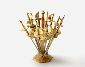 Twelve Toledo Cocktail Swords in a Stand