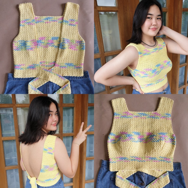 May include: A yellow crochet top with a criss-cross back and a tie at the back. The top has a colourful geometric pattern in blue, pink, and green.
