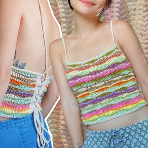 May include: A colorful striped crochet top with a white crocheted halter strap. The top is made with a variety of colors, including pink, green, orange, and purple.
