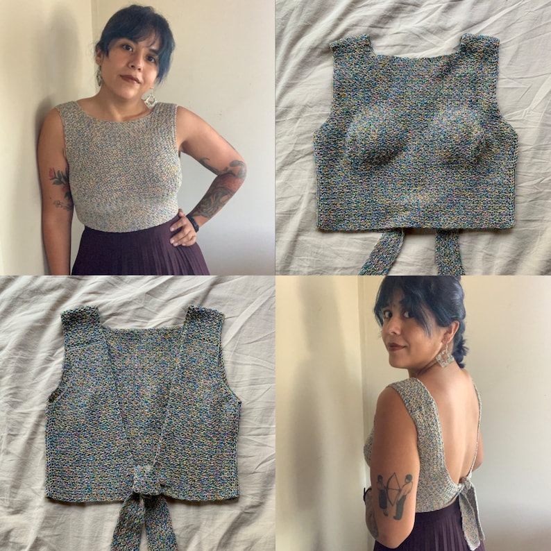 May include: A multicoloured crochet top with a tie at the back. The top is sleeveless and has a square neckline.