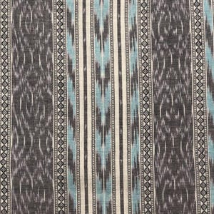 May include: Textile fabric with a vertical striped pattern. The design features alternating bands of gray, off-white, and light blue. The gray sections have a textured, ikat-style pattern. The fabric has a decorative border with small diamond shapes.