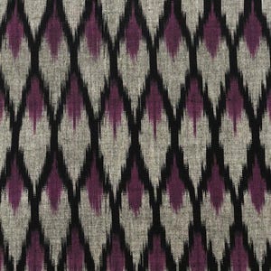 May include: Black and purple ikat fabric with a diamond pattern. The fabric has a textured, woven look.