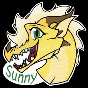 May include: A cartoon illustration of a yellow dragon head with a white outline. The dragon has green eyes, sharp white teeth, and a red mouth. The name "Sunny" is written in green on a white oval. The text "theARTism Studio" is also visible.