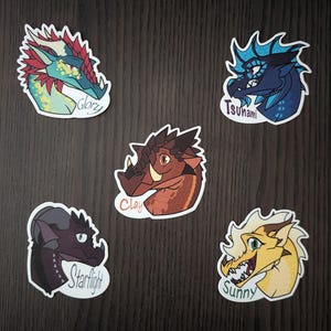 May include: Five colorful dragon head stickers. Each sticker features a different dragon design with names like "Glory", "Tsunami", "Clay", "Starflight", and "Sunny" in a white oval. The dragons have various colors, including red, blue, brown, and yellow.