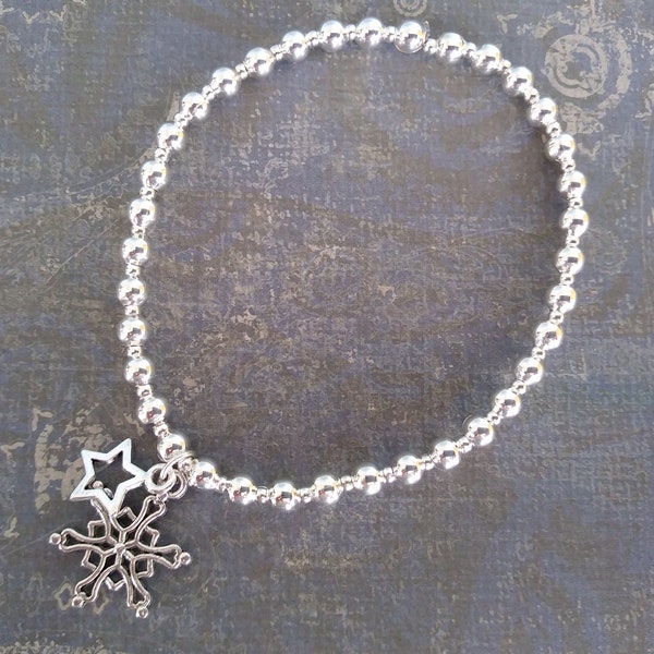 Silver plated snowflake and star charm bracelet, round bead bracelet, festive bracelet, stretch bracelet, winter jewellery, stocking filler