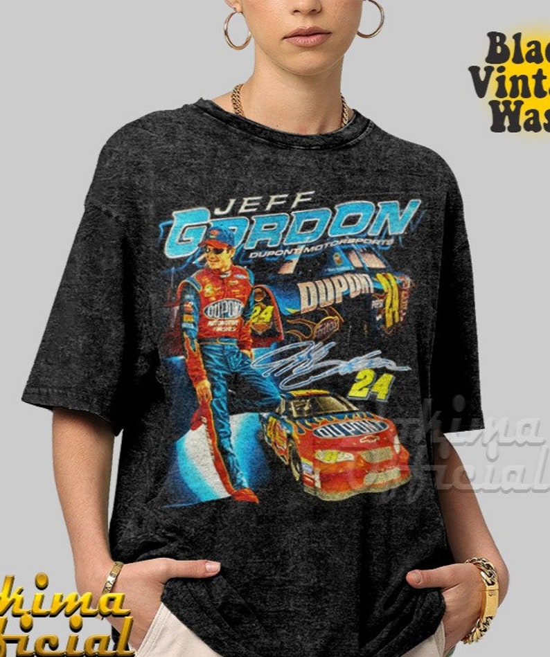 May include: A black t-shirt with a vintage-style graphic of NASCAR driver Jeff Gordon. The graphic features Gordon's name, the DuPont logo, and his race car number 24.